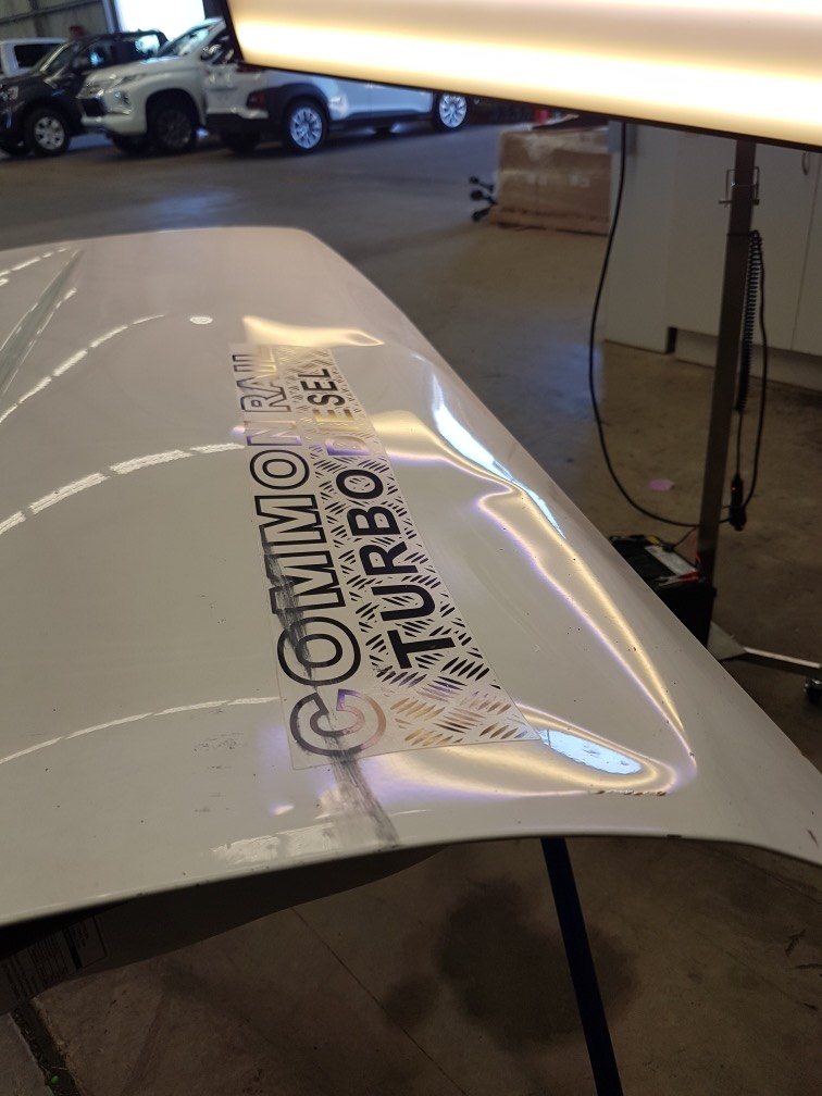 Commodore bonnet dent (before repair)